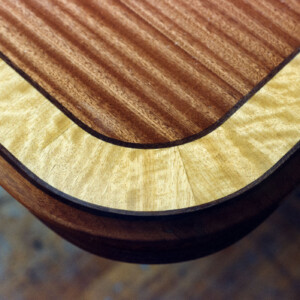 14) 16' dining table, ribbon mahogany, quilted mahogany, satinwood, ebony